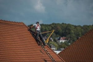 A roofer doing a residential roof repair