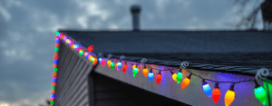 Christmas lights on a roof by Elite Roofing in Denver