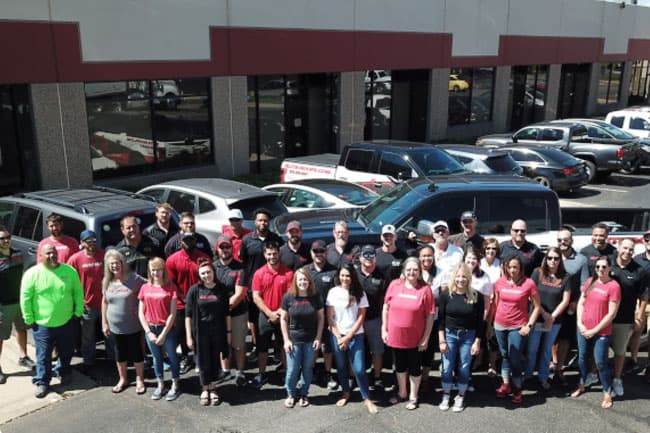 denver roofers, Elite Roofing team outside their office.